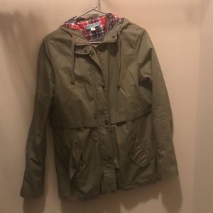 Green jacket with plaid hood.